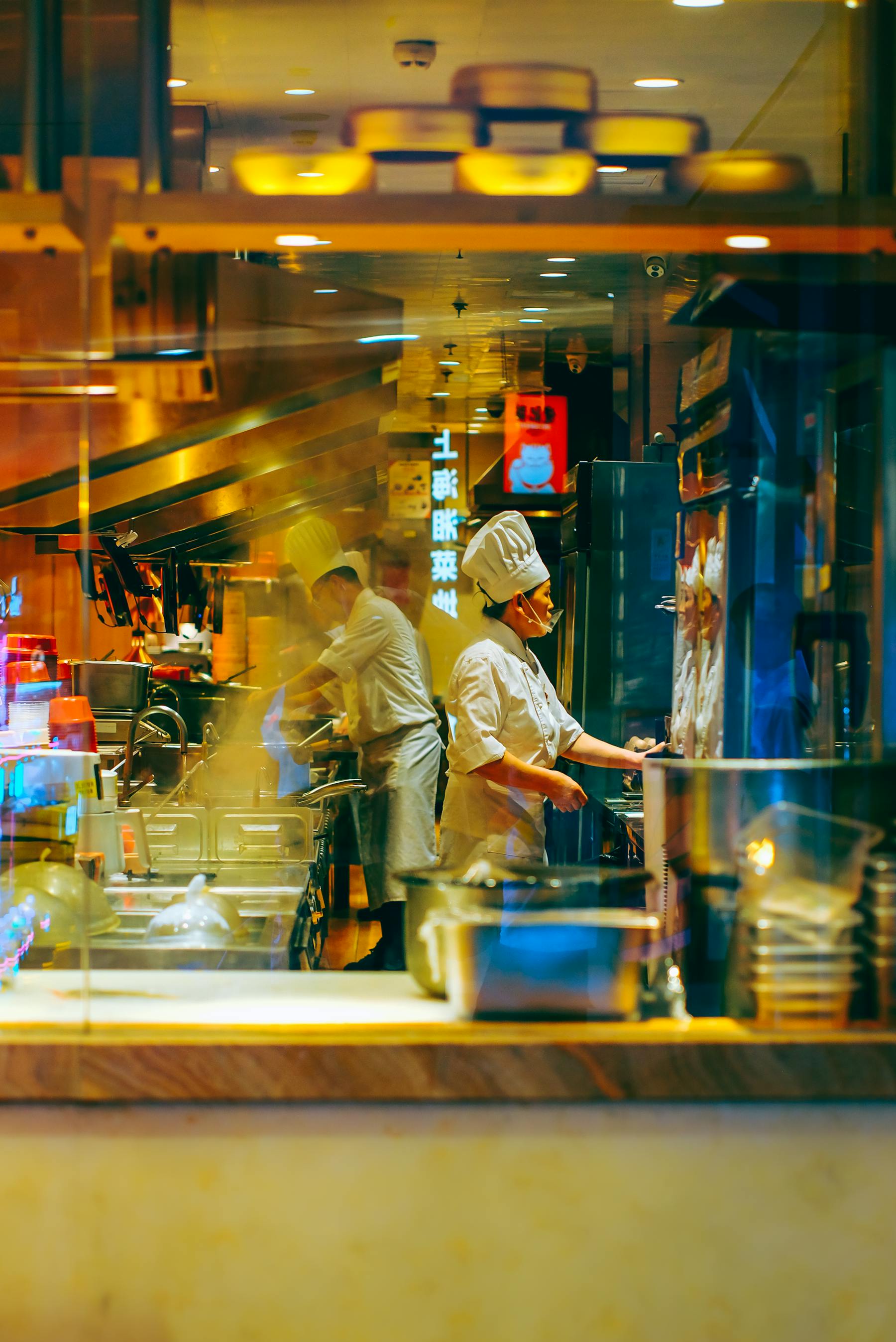 Restaurant kitchen team working during service